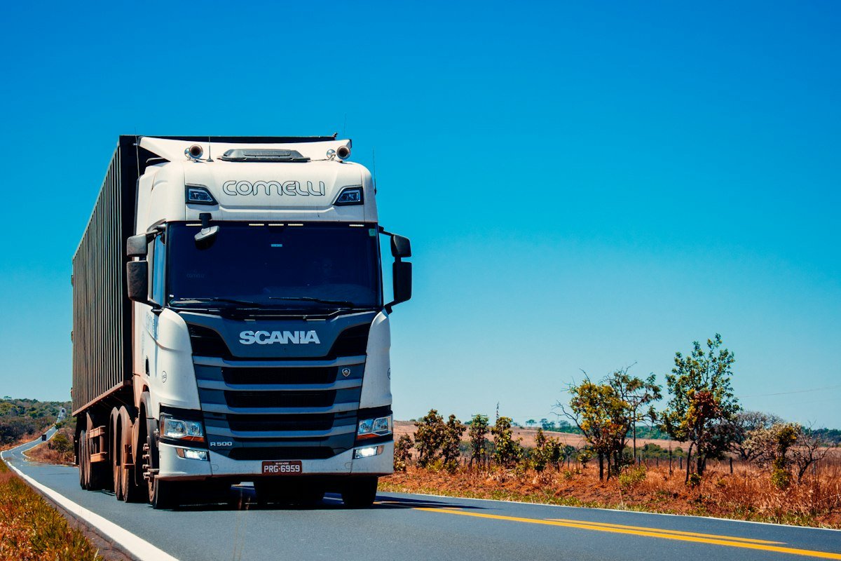 Fleet of logistics transport trucks on highway